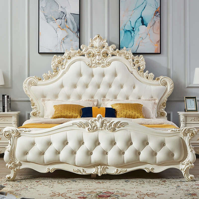 Luxury cream-coloured princess bed with tufted upholstery, ornate gold-accented wood carving, and a grand headboard.