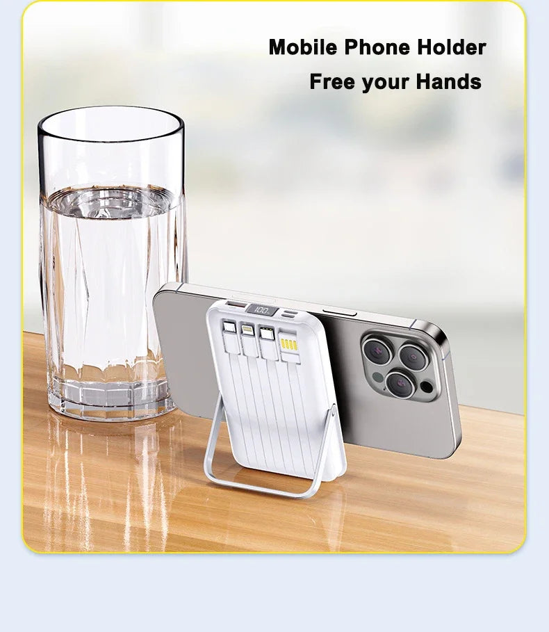 White 20000mAh magnetic power bank with integrated cables and flip-out phone stand, attached to the back of a smartphone.