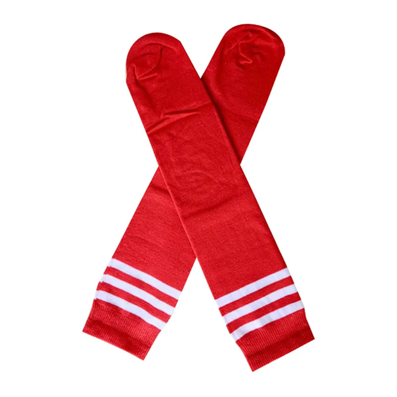 Pair of bright red knee-high socks featuring three white sporty stripes at the top, shown crossed against white.