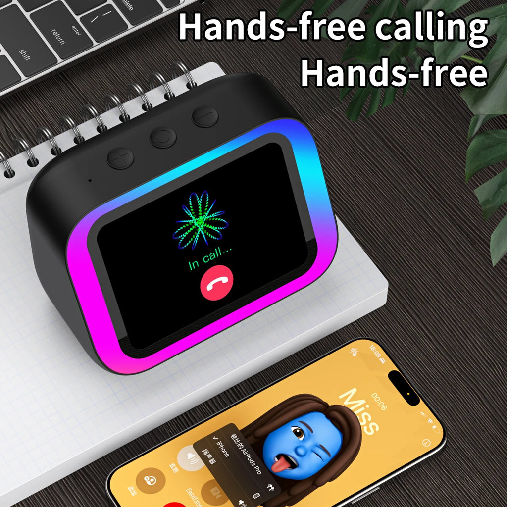 Black smart speaker with a neon-lit screen and display showing an active call, sat on a notepad next to a smartphone.