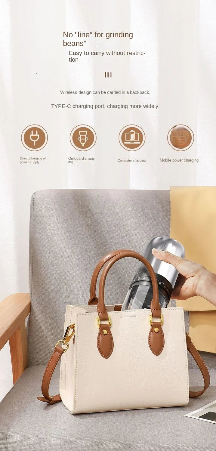 A person puts a portable, silver and black wireless coffee bean grinder into a small, cream-colored handbag.