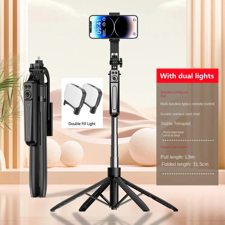 Black plastic and stainless steel tripod selfie stick with phone mount, remote control, and two detachable fill lights.