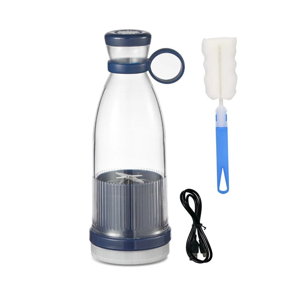 Portable navy blue and clear personal blender with USB charging cable and cleaning brush.