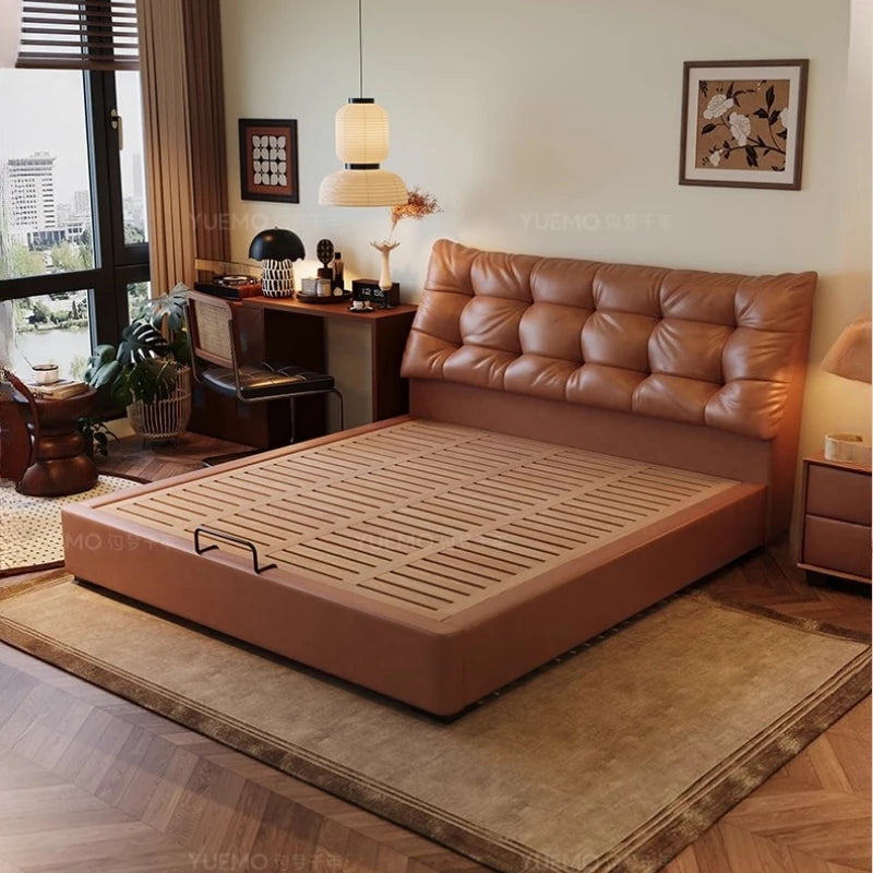 Modern Nordic double bed in tan faux leather with a button-tufted headboard and a slatted ottoman storage base.