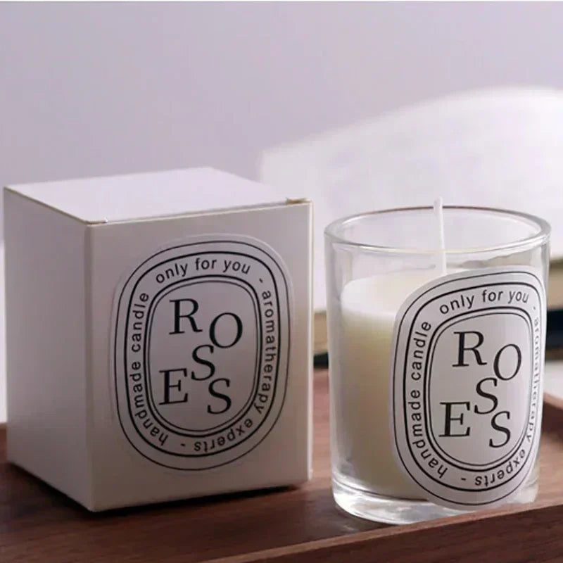 White Rose scented aromatherapy candle in a glass jar, accompanied by its matching minimalist white presentation box.