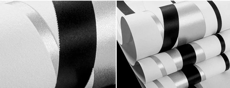 Modern Nordic wallpaper featuring alternating white, black, and shimmering silver stripes with a textured finish.
