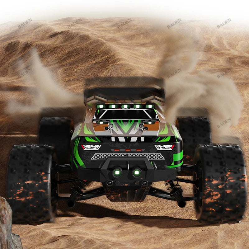 Green and black RC monster truck racing on sand, kicking up dust with large knobby tires and roof lights.