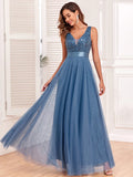 Dusty blue maxi dress featuring a sequined V-neck bodice, satin waistband, and flowing mesh skirt.