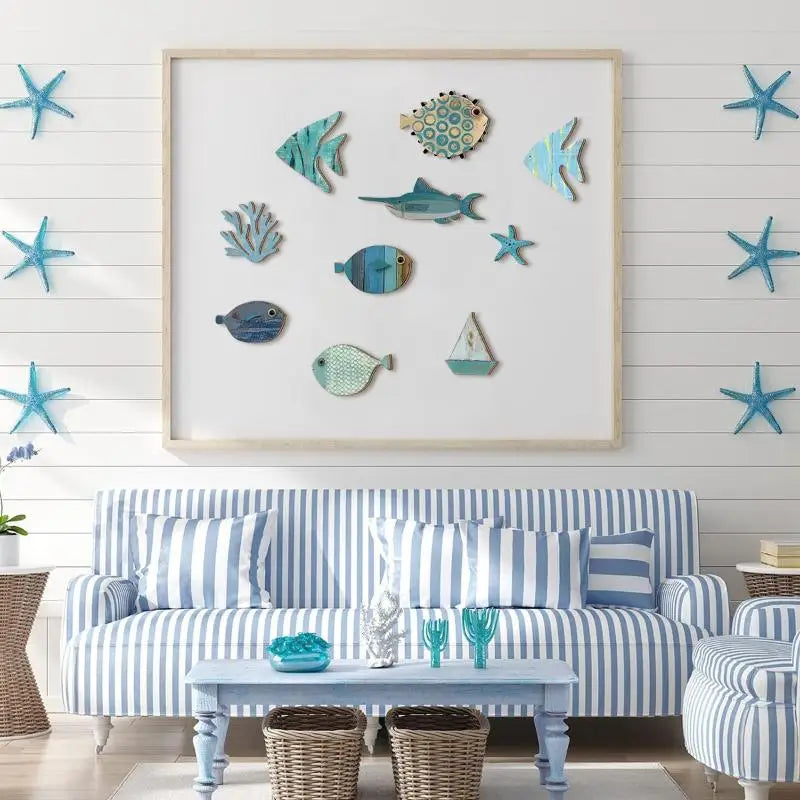 A 10-piece wooden wall art set featuring coastal-themed fish, a sailboat, and starfish in shades of blue and teal.