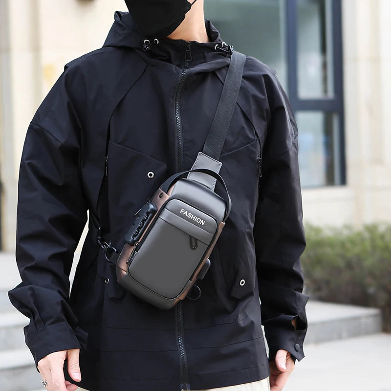 Grey anti-theft crossbody chest bag with an external USB port and combination lock, worn across the chest.