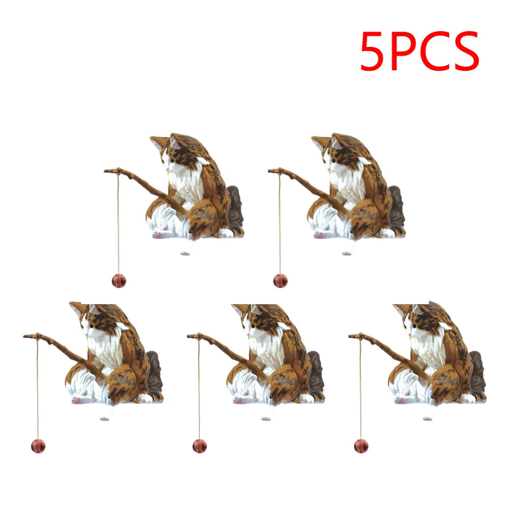 Set of five small, brown and white tabby cat aquarium ornaments, each holding a fishing rod with a tiny dangling lure.