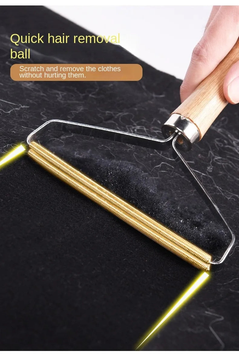 Handheld lint remover with a wooden handle and copper blade, shown removing lint from a black fabric garment.