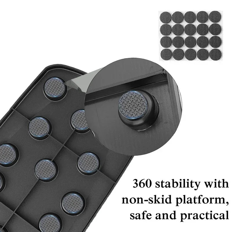 Black foldable push-up board with textured, non-slip rubber stability pads for safe home workouts.