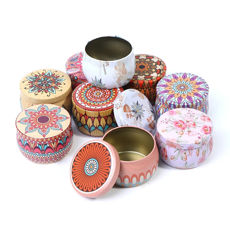 Assorted round metal tins with colourful mandala and floral patterns, featuring removable lids for storage or candles.