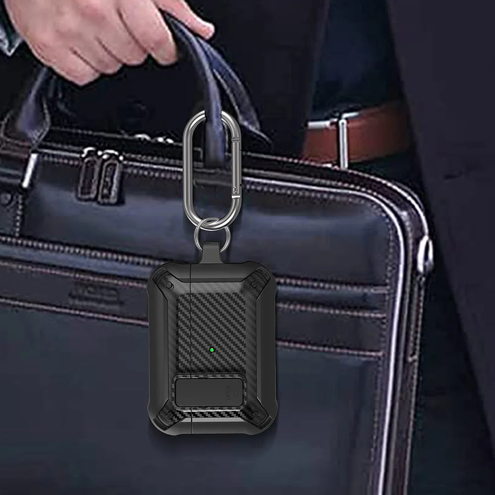 Black rugged carbon fibre-style AirPods protective case with metal carabiner, attached to a briefcase.