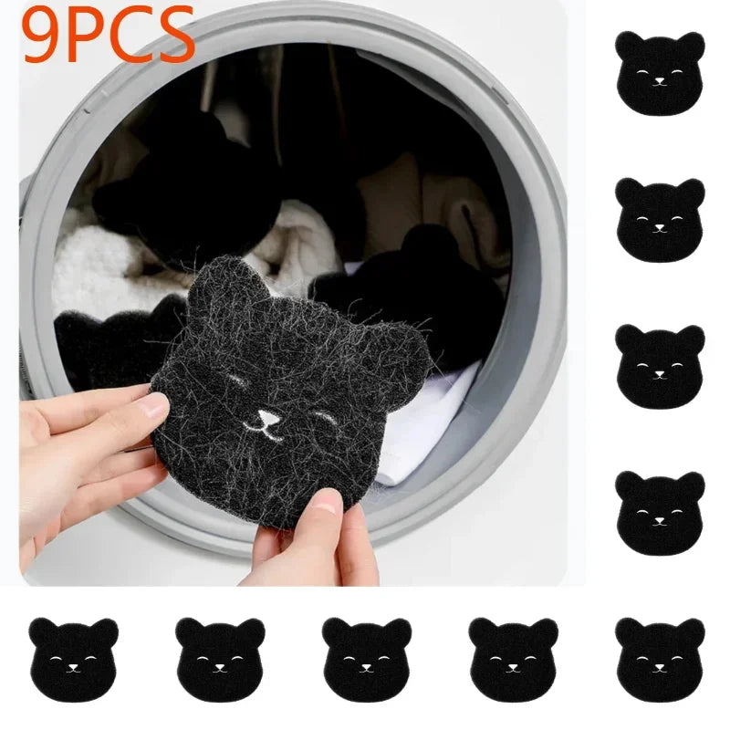 A pack of nine black cat-shaped laundry hair-catcher sponges held up in front of a washing machine door.