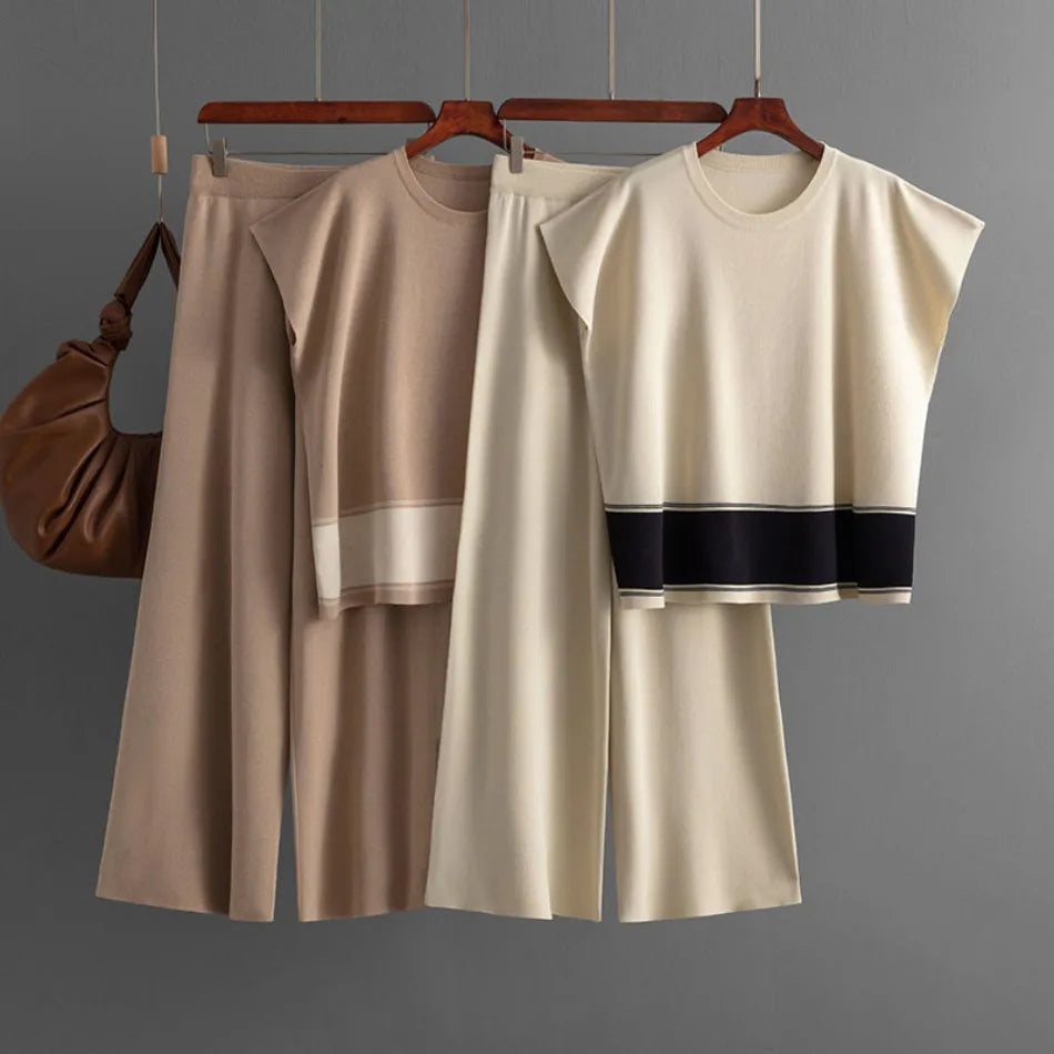 Two sets of sleeveless knit tops and wide-leg trousers in beige and cream, featuring striped hem details.