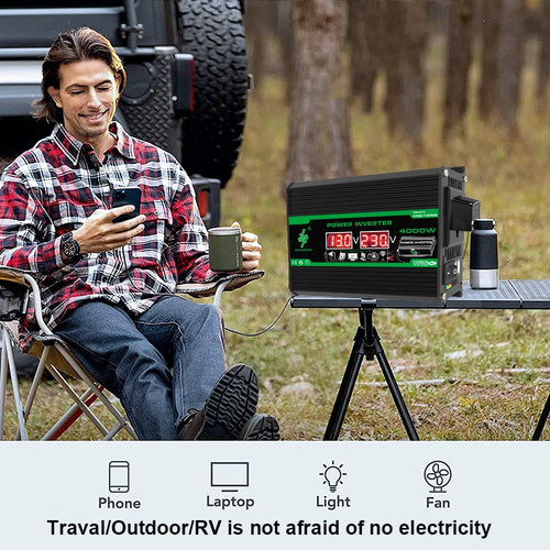 Black 4000W portable power inverter with digital display, shown on a tripod stand during a camping trip.
