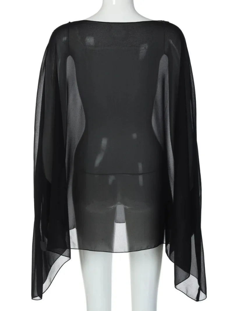 Sheer black chiffon cover-up cape with a loose, flowing silhouette and a wide, rounded neckline.