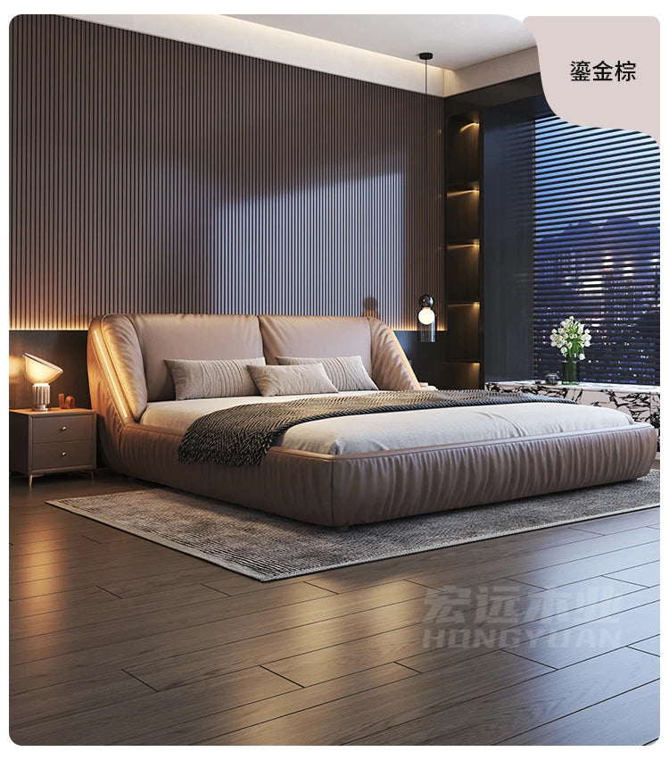 Modern, low-profile king-size upholstered bed frame in a warm taupe finish with a curved, plush headboard.