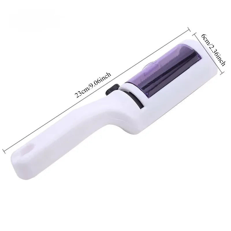 White and purple handheld pet hair remover lint roller, 23cm long, shown against a white background.
