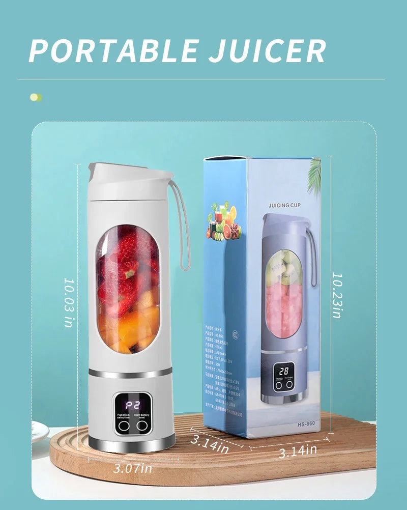 White portable electric juicer blender with a digital display and clear fruit-filled center, standing next to its box.