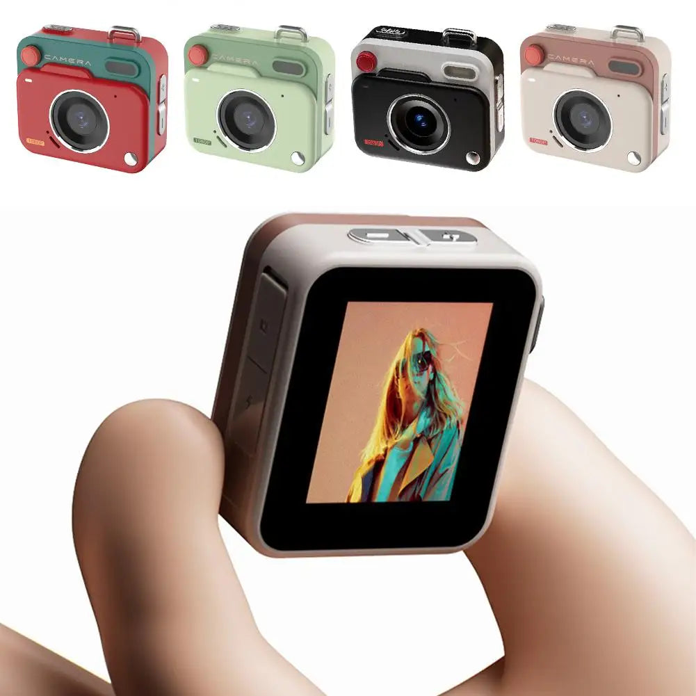 Small, retro-style digital cameras in various colors, shown being held and displaying an image on the rear screen.