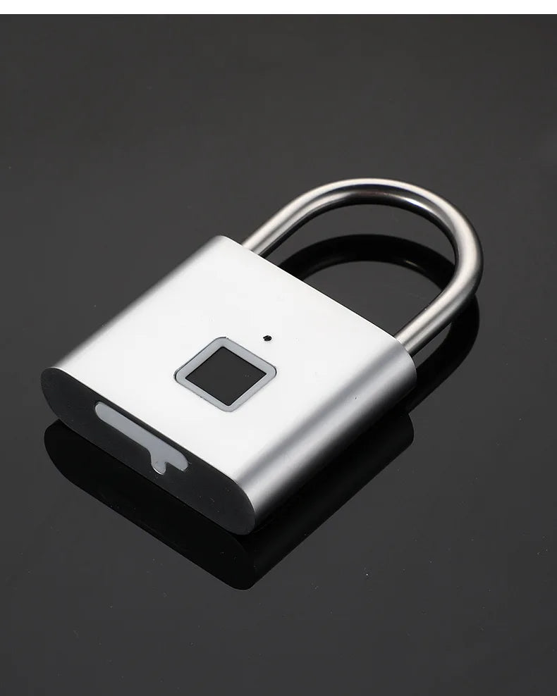 Silver metal padlock with a square fingerprint scanner, LED indicator, and a USB charging port on the bottom.