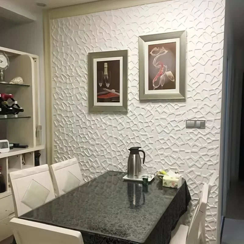 White 3D textured wall tiles with an interlocking geometric pattern, featured as a stylish dining room feature wall.