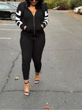 Black textured tracksuit featuring a zip-up hoodie with white sleeve stripes and matching slim-fit joggers.