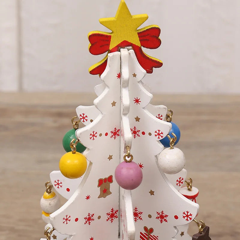 White wooden Christmas tree ornament decorated with red snowflakes, a yellow star topper, and colourful hanging baubles.