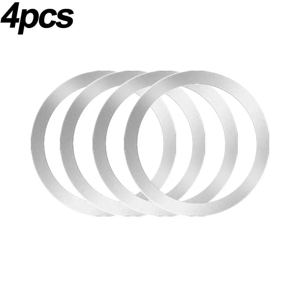 Four silver, circular flat ring gaskets or washers arranged in a row against a white background.
