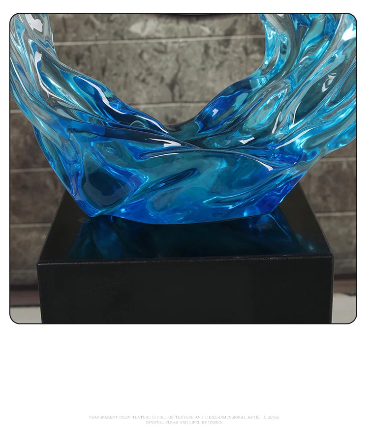Modern blue wave-shaped resin ornament with a glossy, rippled texture, mounted on a square black base.