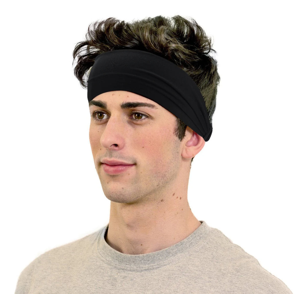 A man wearing a plain, wide black sports headband over his hair against a white background.