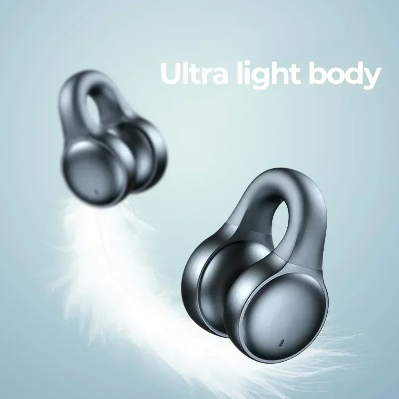 Two dark grey, open-ear style wireless earbuds floating with a feather, suggesting an ultra-lightweight design.