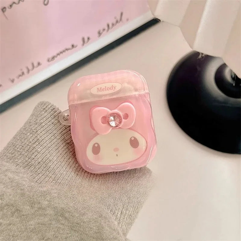 Pink clear TPU AirPods case featuring My Melody, a 3D bow, and crystal charm. Fits standard AirPods 1/2.