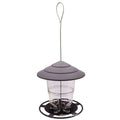 Clear plastic bird feeder with a grey, ribbed, pagoda-style roof and a circular black base, hanging from a wire loop.