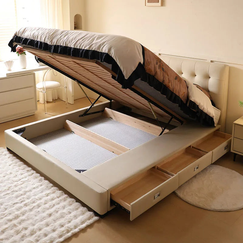 Minimalist cream storage bed with an ottoman lift mechanism and integrated side drawers in a bright bedroom.