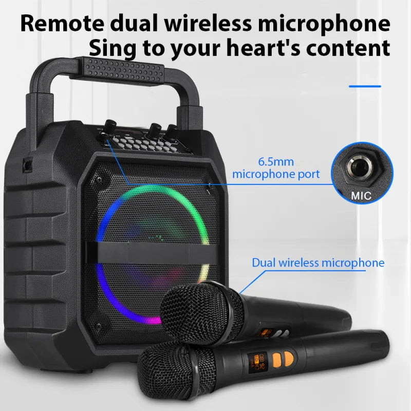 Portable black wireless speaker with an LED light ring, carry handle, and two wireless microphones.