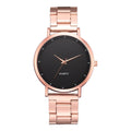 Elegant ladies' rose gold stainless steel watch with a minimalist black dial and matching metallic link strap.
