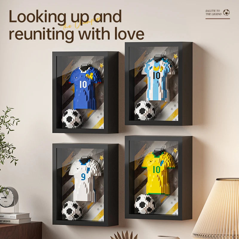 Four framed wall art displays featuring 3D brick-built football shirts and balls in various team colours.