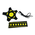 Volleyball training aid set with a star-shaped ball harness, waist strap, and elastic cord in black and yellow.
