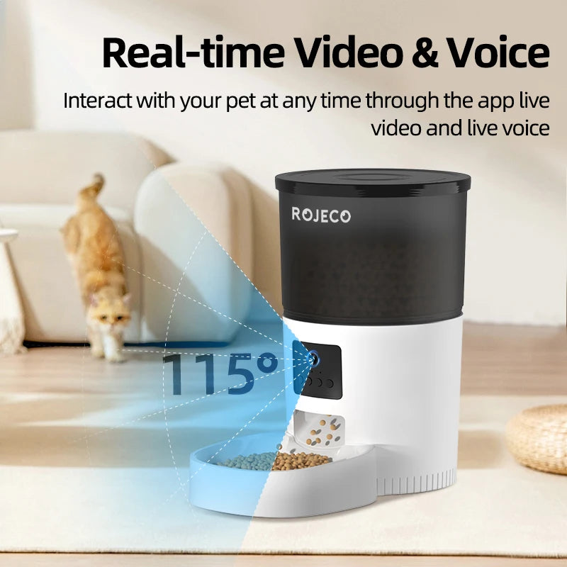 White and black automatic pet feeder with an integrated camera and feeding bowl, showing a wide-angle video feed.