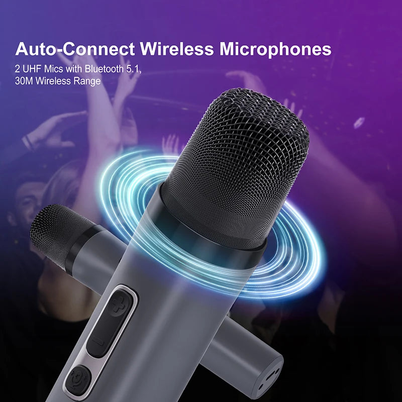Two sleek, dark grey wireless microphones with black mesh heads and control buttons against a purple party background.