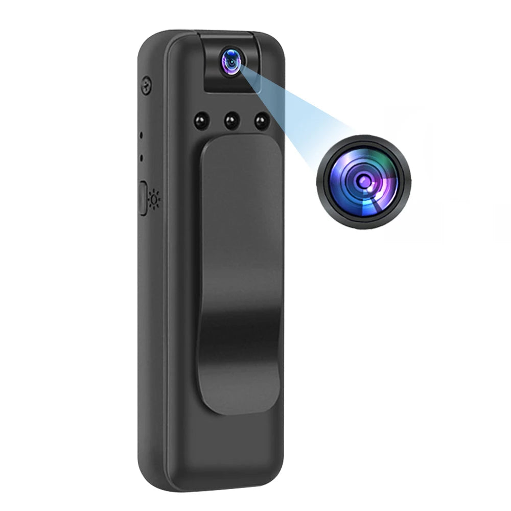 Black plastic pocket body camera with a clip and a circular lens detail showing a close-up of the camera aperture.