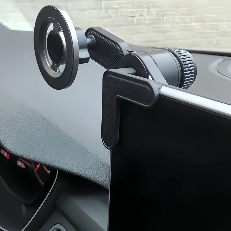 Black L-shaped magnetic phone mount attached to a car dashboard display screen.