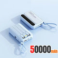 Two light blue 50,000mAh portable power banks with built-in charging cables and carry straps.