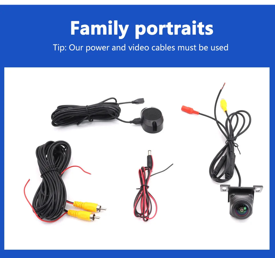 Black HD reversing camera kit with fisheye lens, including wiring looms and connection cables on a white background.