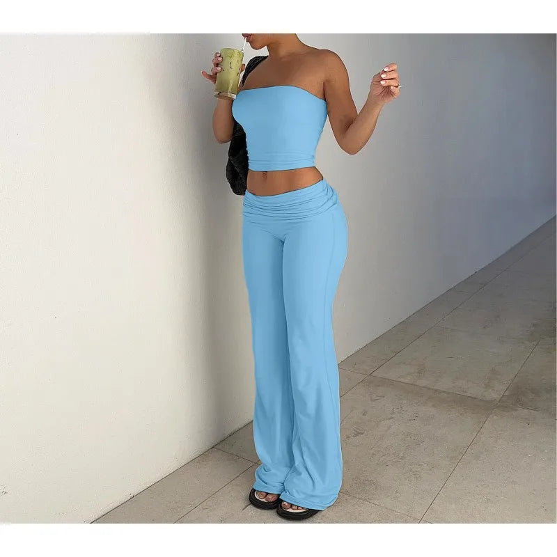 Light blue two-piece set featuring a strapless crop top and high-waisted, wide-leg trousers.