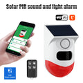 White and red solar-powered security alarm with speaker and sensor, controlled by a smartphone app or remote fob.